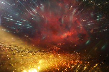 Soyut altın ve siyah parıltılı ışıkların arkaplanı. Odaklanamadı