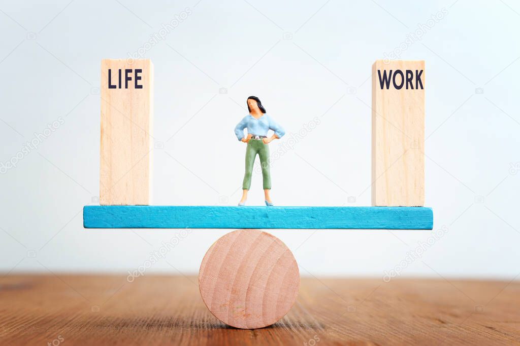 Concept image of woman finding thr right balance on seesaw