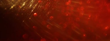 Soyut kırmızı, altın ve siyah parıltılı ışıkların arkaplanı. Odaklanamadı