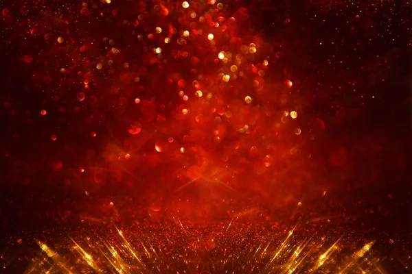 Hintergrund Aus Abstrakten Roten Goldenen Und Schwarzen Glitzerlichtern Defokussiert — Stockfoto