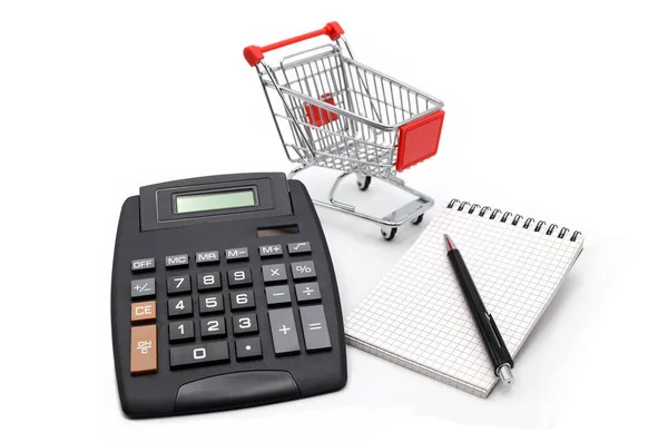 shopping cart with paper note book and calculator on white background