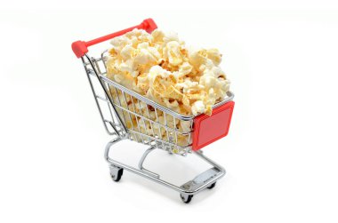 shopping cart filled with popcorn on white background clipart