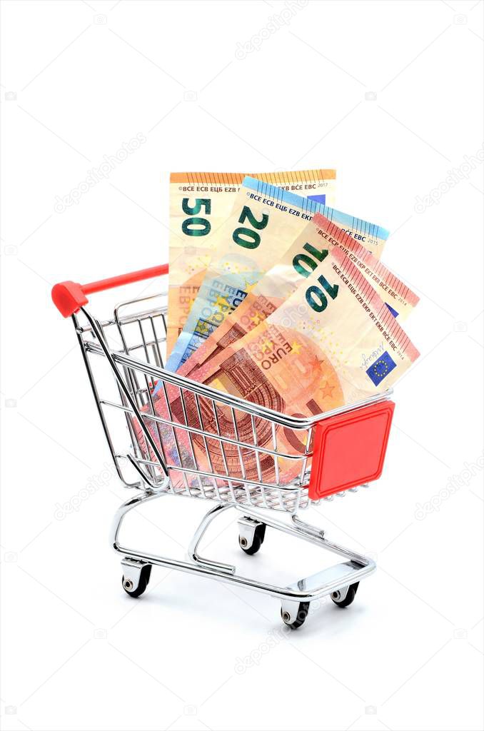  shopping cart filled with euro money notes on white background