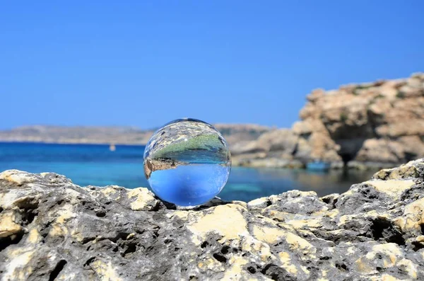 glass sphere on stone