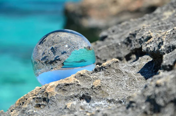 crystal glass sphere with rocks