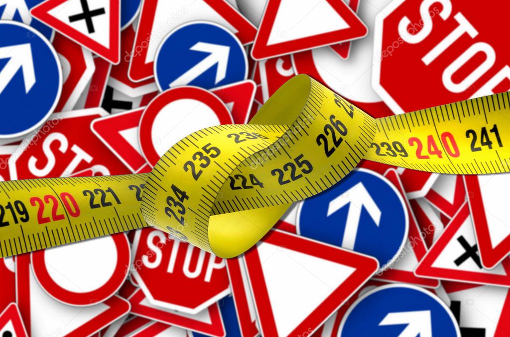 tape measure tangled close up  with traffic road signs