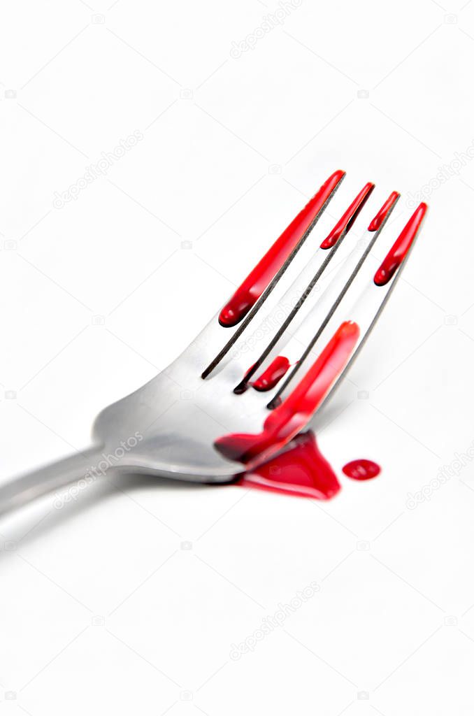 fork with blood on white background