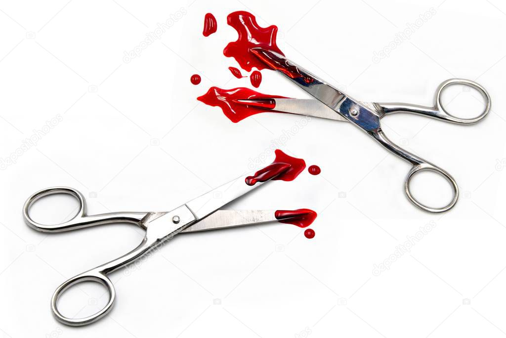 scissors with blood on white background