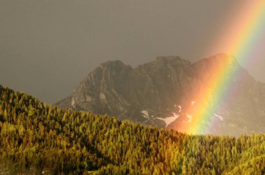 rainbow above the mountains clipart