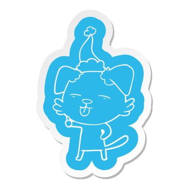 Noel Baba şapkası giyen dilini bir köpek çizgi film etiketi