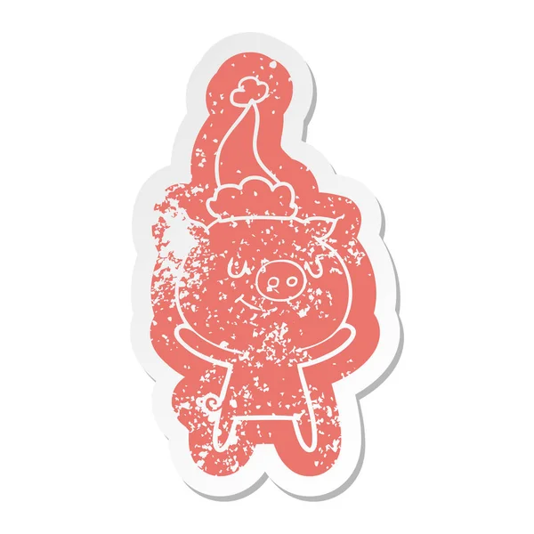 Happy cartoon distressed sticker of a pig wearing santa hat — Stock Vector