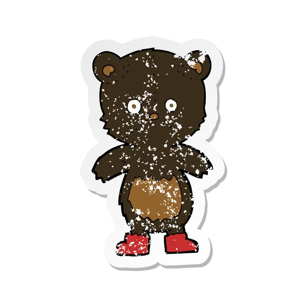 Retro nödställda klistermärke av en tecknad black bear cub — Stock vektor