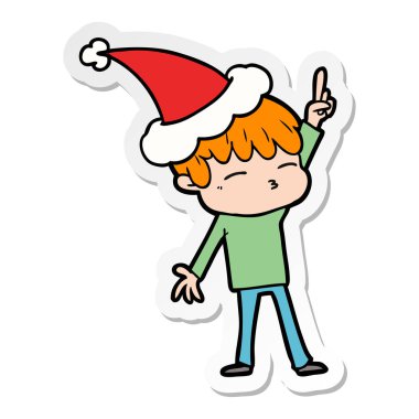 Noel Baba şapkası giyen meraklı bir çocuk etiket karikatür el çekilmiş