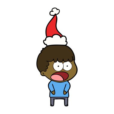 Noel Baba şapkası giyen bir şok adamın çizgi çizme