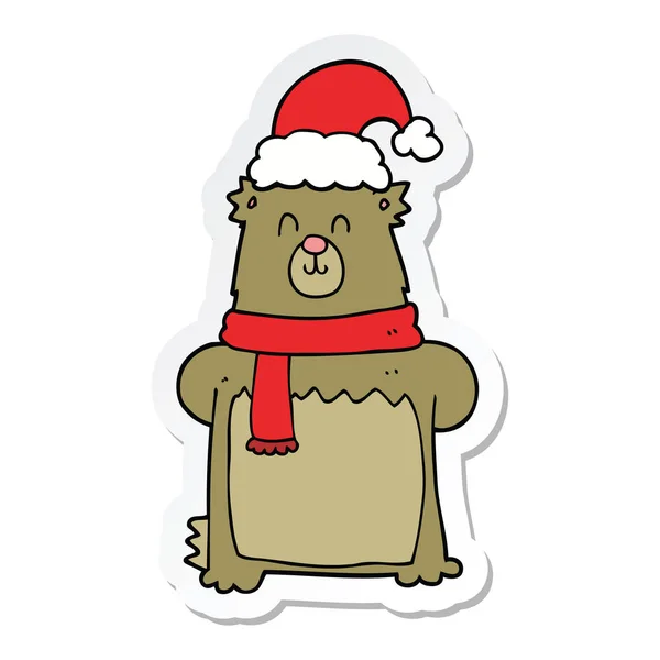 Sticker of a cartoon bear wearing christmas hat — Stock Vector