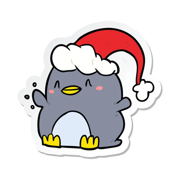 Sticker of a cartoon penguin wearing christmas hat — Stock Vector