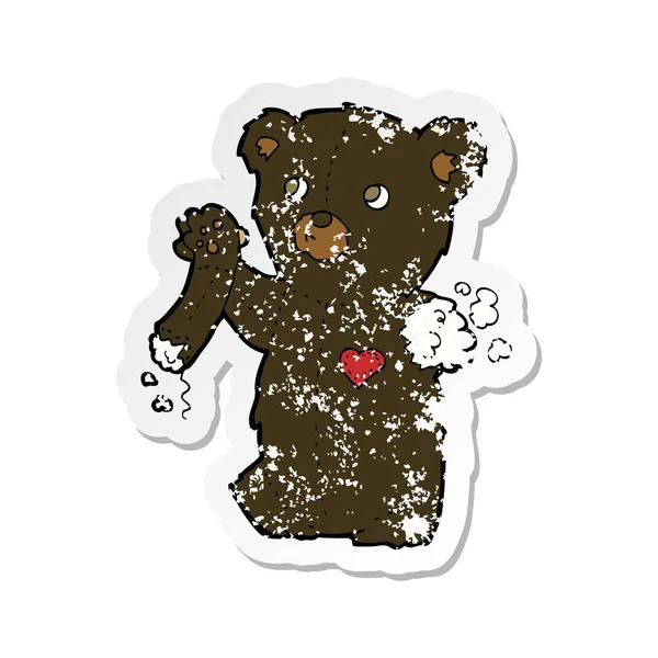 Pegatina retro angustiado de un oso negro de peluche de dibujos animados con rasgado — Archivo Imágenes Vectoriales