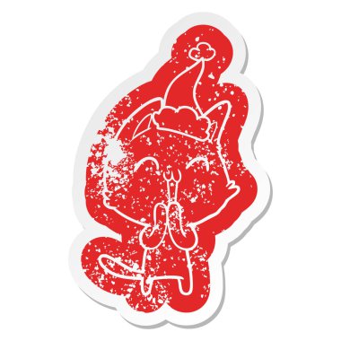 Noel Baba şapkası giyen bir kedi mutlu karikatür sıkıntılı etiket