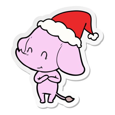 etiket karikatür Noel Baba şapkası giyen bir filin şirin el çekilmiş