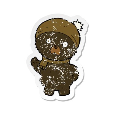 Retro sıkıntılı etiket bir çizgi film sevimli siyah ayı kış şapka ve atkı