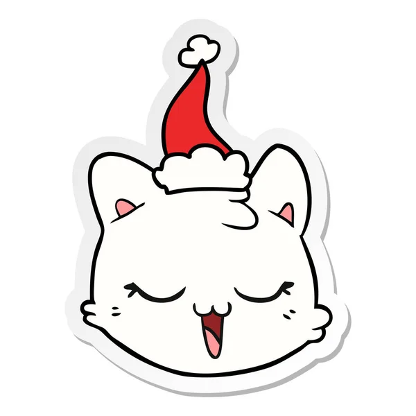 Etiket karikatür Noel Baba şapkası giyen bir kedi yüz — Stok Vektör