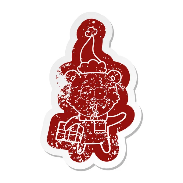 Lachender Teddybär mit Weihnachtsgeschenk mit Weihnachtsmütze — Stockvektor