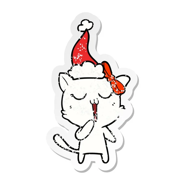 Autocollant affligé dessin animé d'un chat portant un chapeau de Père Noël — Image vectorielle