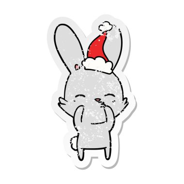 meraklı tavşan bir giyen santa şapka etiket karikatür sıkıntılı