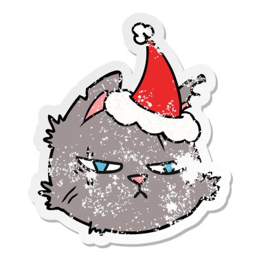 sıkıntılı etiket karikatür Noel Baba şapkası giyen bir zor kedi yüz el çekilmiş