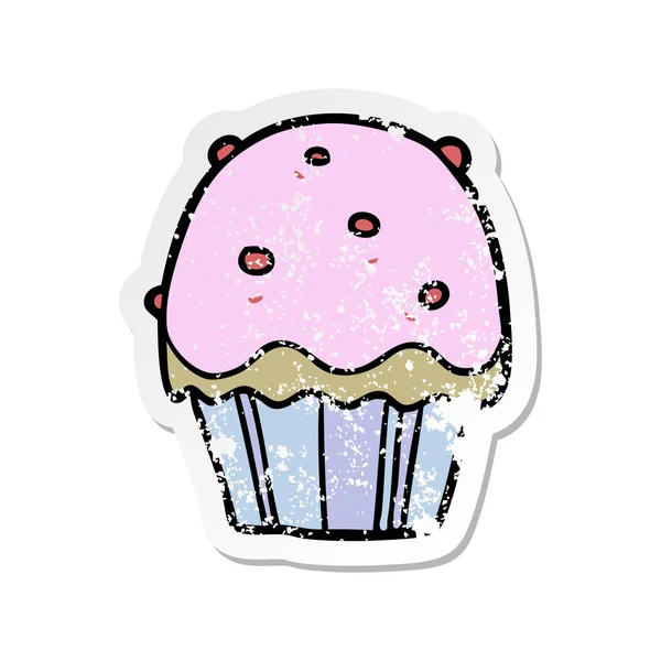 Verontruste sticker van een cartoon cupcake — Stockvector