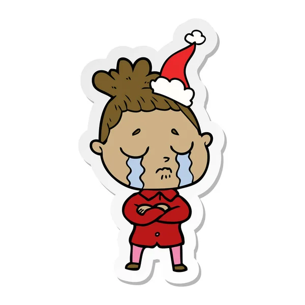 Autocollant dessin animé d'une femme en pleurs portant un chapeau de Père Noël — Image vectorielle