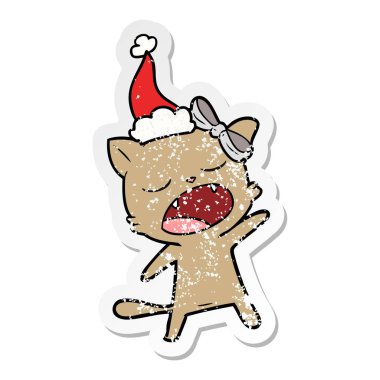 sıkıntılı etiket karikatür Noel Baba şapkası giyen bir şarkı kedi