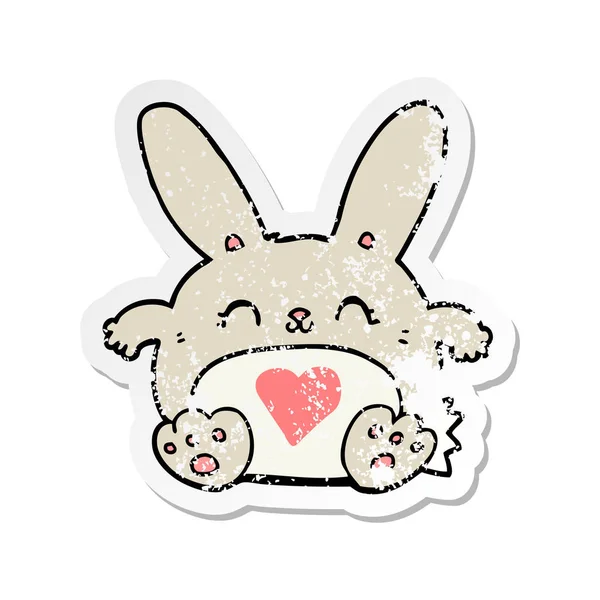Nödställda klistermärke av en gullig tecknad kanin med kärlek hjärta — Stock vektor
