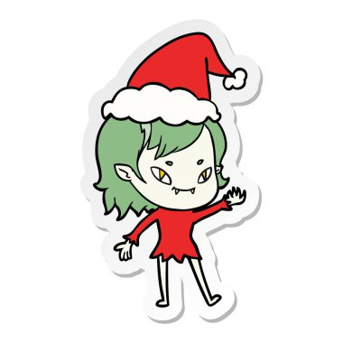 etiket karikatür Noel Baba şapkası giyen bir dostu vampir kız