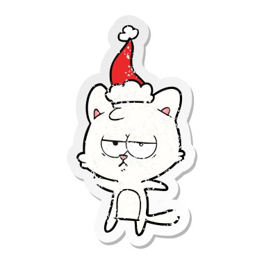 sıkıntılı etiket karikatür Noel Baba şapkası giyen bir kedi sıkılmış el çekilmiş