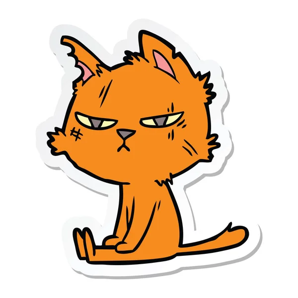 一个强硬的卡通猫坐的贴纸 — 图库矢量图片