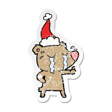 Noel Baba şapkası giyen ağlayan ayı sıkıntılı etiket çizgi film