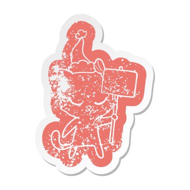 sevimli çizgi etiket bir kedi santa giyen işaretiyle sıkıntılı.