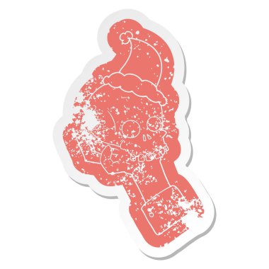 santa giyen kafatası tutan bir el sıkıntılı Etiket cartoon