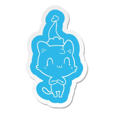 Noel Baba şapkası giyen bir mutlu kedi çizgi film etiketi