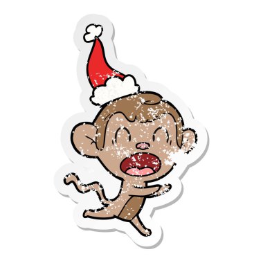 elle çizilmiş bağırarak etiket karikatür Noel Baba şapkası giyen bir maymunun sıkıntılı