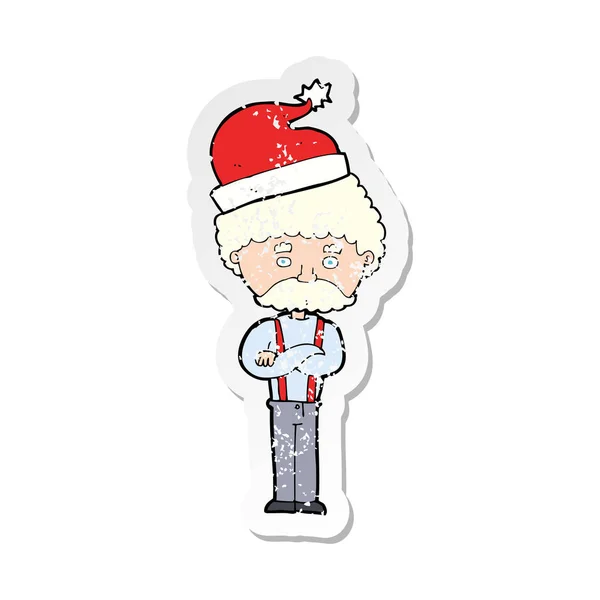 Retro distressed sticker of a cartoon old man in christmas hat — Stock Vector
