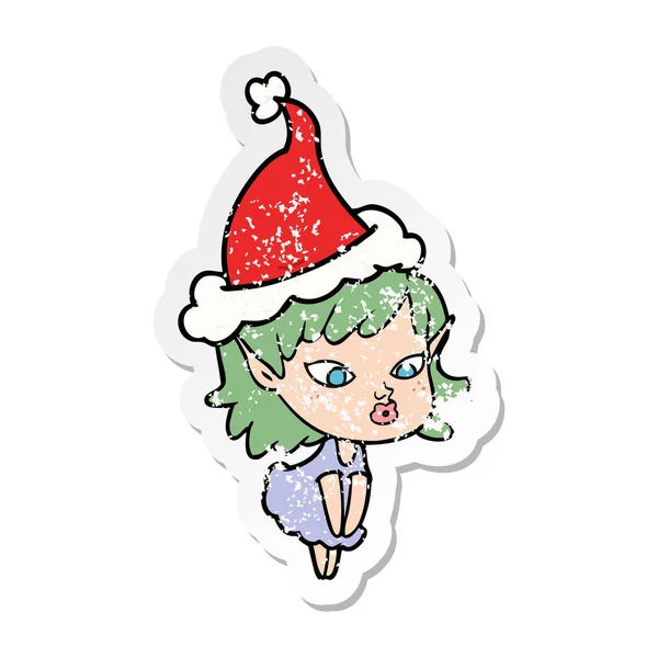 Pretty distressed sticker cartoon of a elf girl wearing santa ha — Stock Vector
