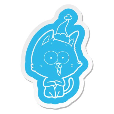 Noel Baba şapkası giyen bir kedinin komik ilginç karikatür etiket