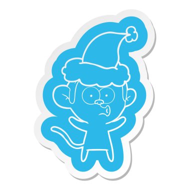 Noel Baba şapkası giyen bir sürpriz maymunun ilginç çizgi film etiketi