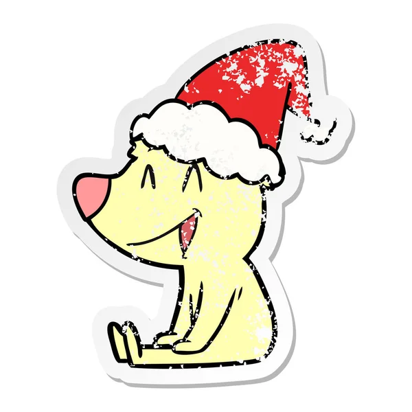 Sitzender Bär bekümmert Aufkleber Karikatur eines tragenden Weihnachtsmannes — Stockvektor