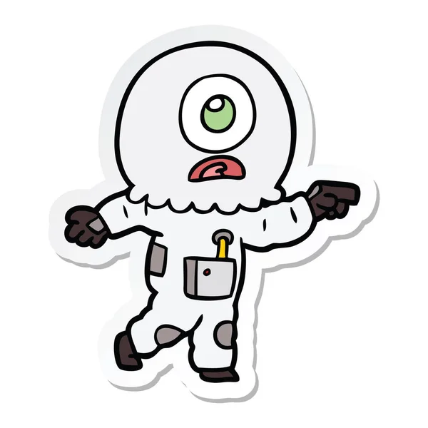 Sticker of a cartoon cyclops alien spaceman pointing — Stock Vector