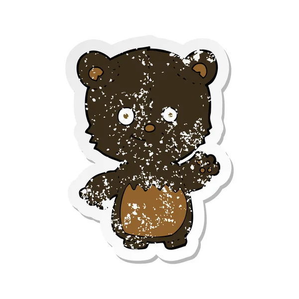 Retro distressed sticker of a cartoon black bearcub waving — Stock Vector