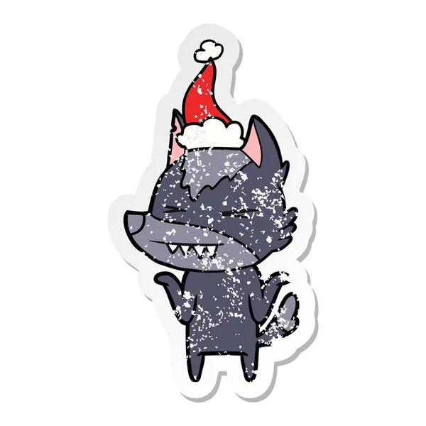 Angry wolf distressed sticker cartoon of a wearing santa hat — Stock Vector