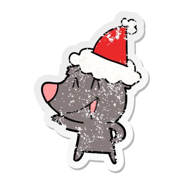 ayı sıkıntılı etiket karikatür giyen Noel Baba şapkası, gülüyor